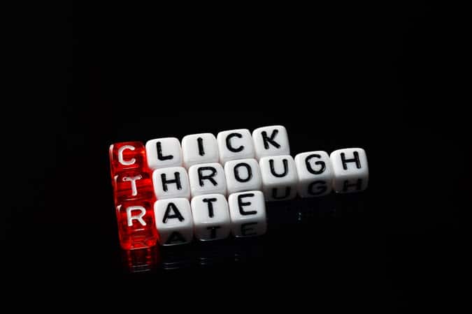 Red Dice are Lined up Horizontally, Spelling the Acronym "CTR" for “Click Through Rate.” The Remaining White Dice are Black-lettered and Vertically Lined to Finish the Spelling of the Three Words.