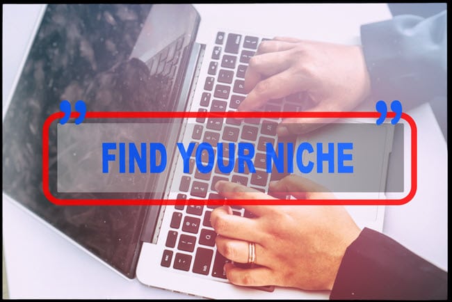 "Find Your Niche!" Quoted on Top of a Laptop Keyboard with a Person Typing.